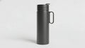 A matte black insulated water bottle with a handle and flip-up spout lid