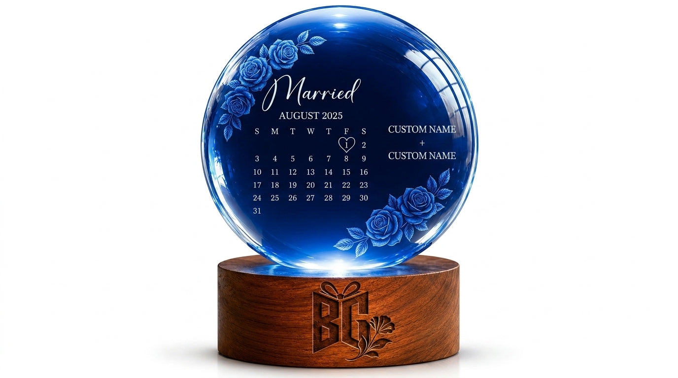 Blue crystal ball with engraved text on a wooden base